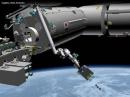 The ISS Kibo robotic arm deploying CubeSats. [NASA image]
